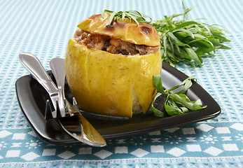 Image showing  Apples stuffed with chicken, prunes and walnuts.