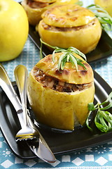 Image showing Apples stuffed with chicken, prunes and nuts.