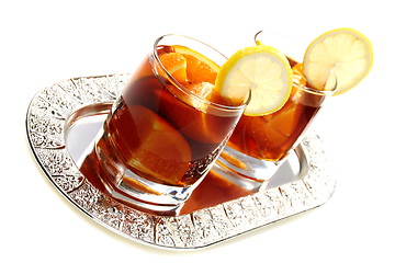 Image showing Hot black tea with orange.