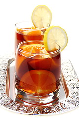 Image showing Hot black tea with orange.