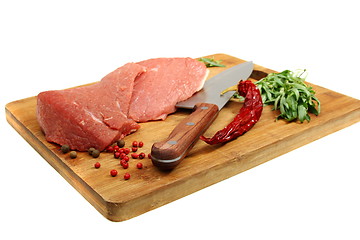 Image showing Fresh meat and spices on the kitchen board.
