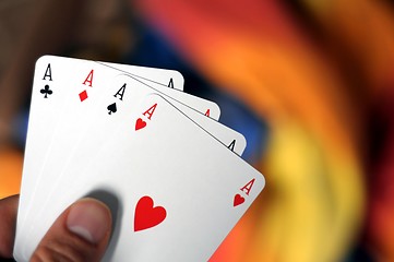 Image showing hand holding four aces