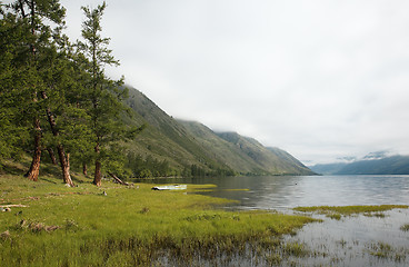 Image showing Boat on the bank of mountain lake