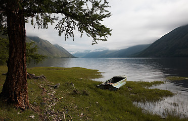 Image showing Boat on the bank of mountain lake