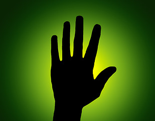 Image showing Silhouette Stop Hand on Green Colored Background