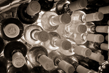 Image showing wine bottles stacked up