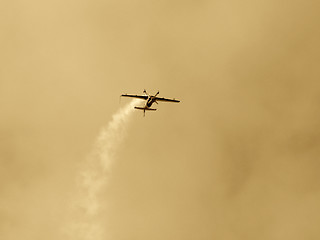 Image showing Upside-down plane at the European Aerobatic Championship. Sepia version