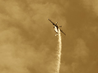 Image showing Upside-down plane at the European Aerobatic Championship. Sepia version