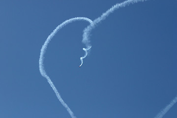 Image showing A plane is doing the figure of the heart from the smoke. European Aerobatic Championship