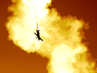 Image showing Plane in the cloud of smoke at the European Aerobatic Championship. Highly contrasted and toned, seems like a plane crash