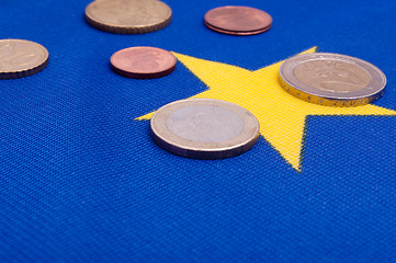 Image showing Euro Coins on EU Flag