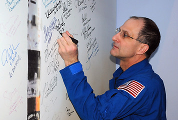 Image showing Signing a Poster