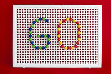 Image showing Go text.Colorful letters on mosaic.