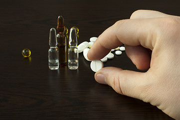 Image showing Drugs and Hand holding pill