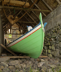 Image showing Traditional Faroese fishing boat made of wood in an old bo