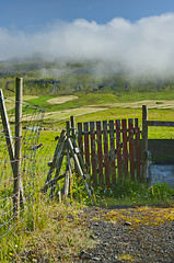 Image showing Old red wooden gate