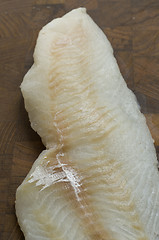 Image showing Raw Cod on a wooden butcher 