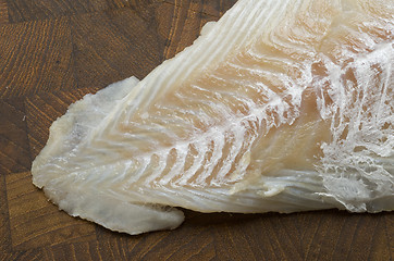 Image showing Raw Cod on a wooden butcher 