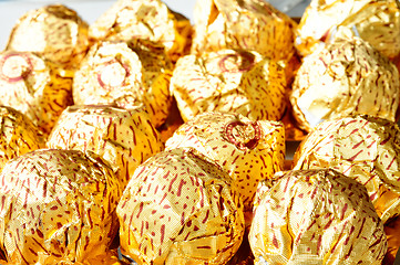 Image showing Chocolate wrapped in golden paper