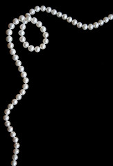 Image showing White pearls on the black velvet 