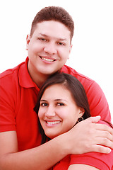 Image showing Portrait of a happy young couple having fun together against whi
