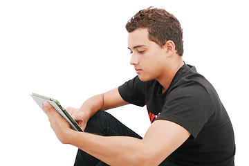 Image showing School boy with electronic tablet sitting in the floor