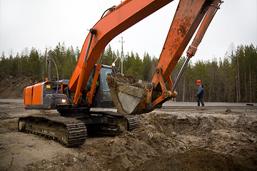 Image showing Backhoe digging trench