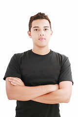 Image showing Young man in black shirt with arms crossed isolated on white