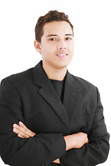Image showing Young smiling latin man looking at camera isolated on white back