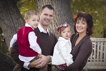 Image showing Young Attractive Parents and Children Portrait in Park