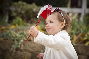 Image showing Adorable Baby Girl Playing in Park