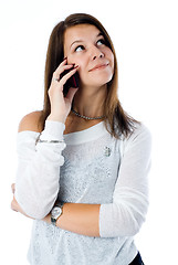 Image showing Pretty woman talking by mobile phone