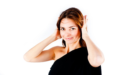 Image showing Hear no evil - Young woman covering her ears