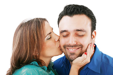 Image showing Lovely woman kissing her boyfriend, isolated on white