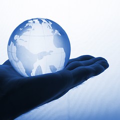 Image showing hand holding globe