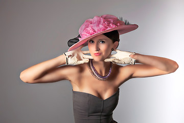 Image showing Young stylich woman with purple retro hat