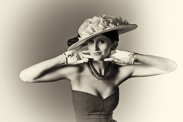 Image showing Young srtylish woman with retro hat