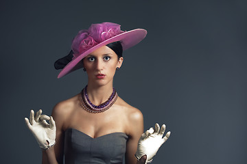 Image showing Young stylich woman with purple retro hat