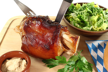 Image showing fresh knuckle of pork with cutlery