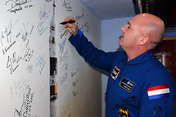 Image showing Signing a Poster