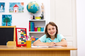 Image showing Schoolgirl doing homework