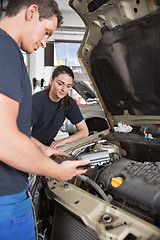 Image showing Mechanics with Diagnostic Equipment