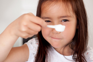 Image showing Young girl Measuring Ingredient