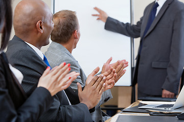 Image showing Business people applauding during presentation