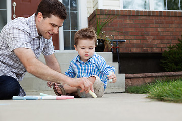 Image showing Father Drawing With Chalk on Ground