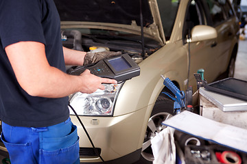 Image showing Mechanic with Diagnostic Equipment