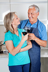 Image showing Senior Couple Toasting Wine