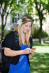 Image showing Young girl using cell phone