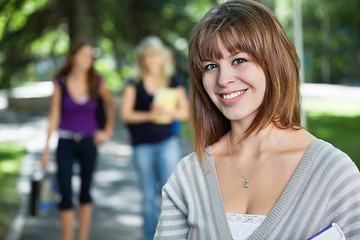 Image showing Young college girl smiling