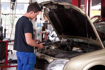 Image showing Mechanic Servicing Car